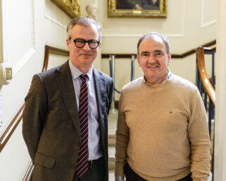 Colin Graham and Pat Fenlon pose for a photo together on the RIA staircase.