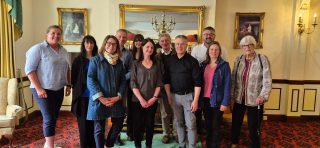 Group of ten photographed in Dorrian's Hotel