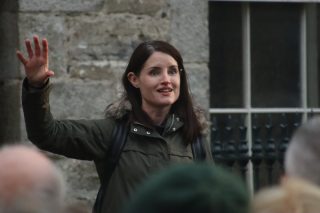 Angela Byrne stands in front of an exhibition on Ballyshannon