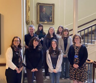 Group posing for a photograph in the hall of the Royal Irish Academy