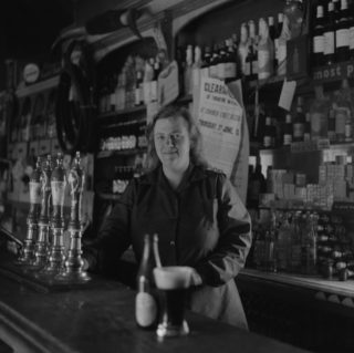 Miss Furey behind the bar, Moyvalley