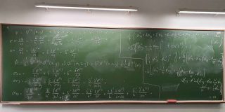 A chalkboard filled with various mathematical equations and symbols, showcasing complex calculations and problem-solving.