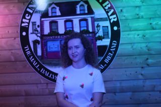 Singer Oonagh Mc Ardle standing on a stage in McIntyre's Pub, Ballyshannon