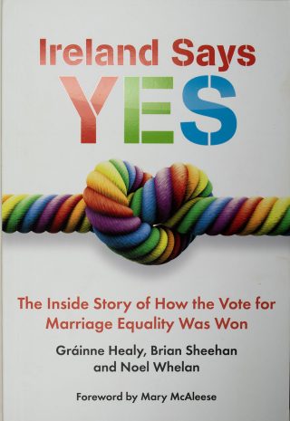 Book cover with a colourful title (Ireland Says Yes) and a picture of rope made of rainbow colour threads, tied in a knot that looks like a heart.